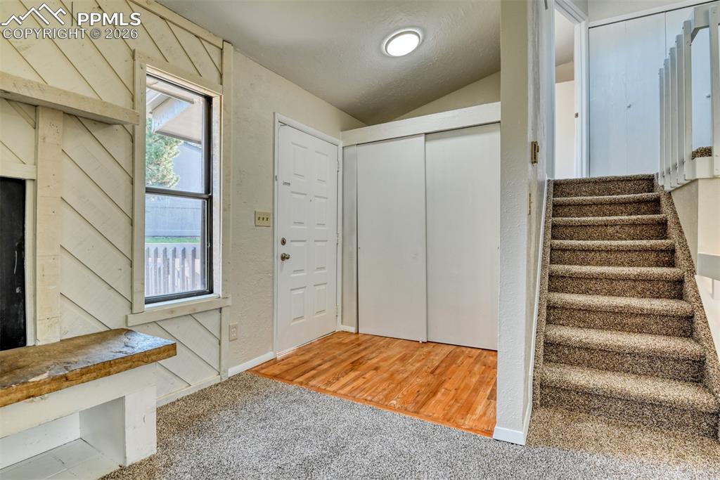 1591 Territory Trail Colorado Springs, CO 80919 - Photo 3 of 13 a bedroom with a bed and wooden floor