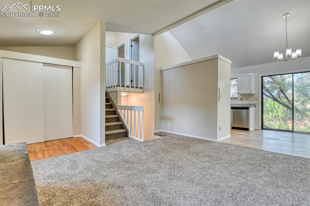 1591 Territory Trail Colorado Springs, CO 80919 - Photo 4 of 13 an empty room with a fireplace and entryway