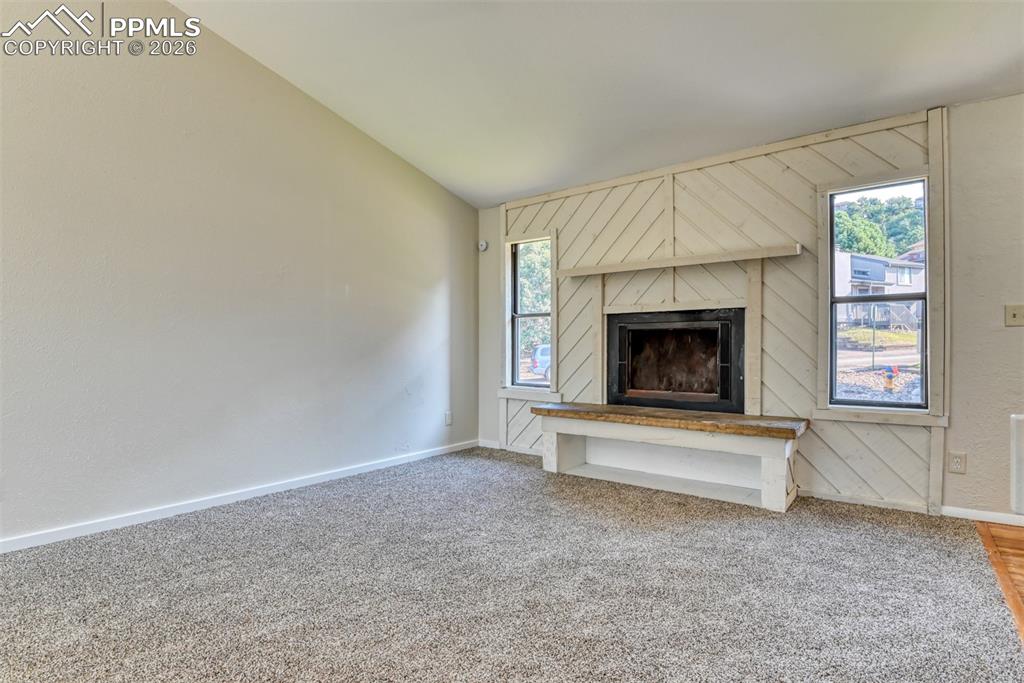 1591 Territory Trail Colorado Springs, CO 80919 - Photo 5 of 13 a living room with a fireplace