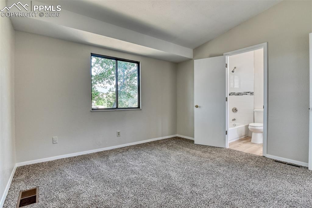 1591 Territory Trail Colorado Springs, CO 80919 - Photo 8 of 13 a view of an empty room with a window