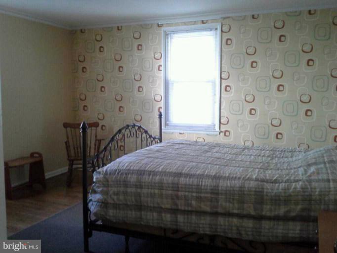 421 Rolling Rd. Catonsville, MD 21228 - Photo 12 of 26 a bedroom with a bed and a window