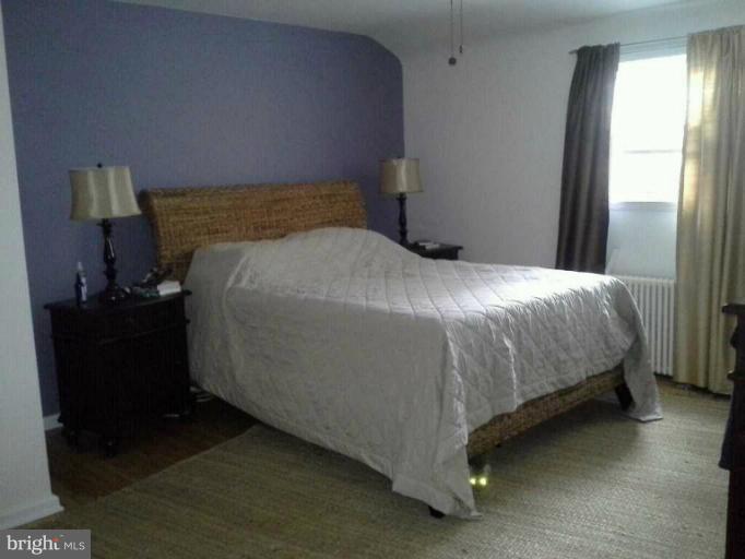 421 Rolling Rd. Catonsville, MD 21228 - Photo 16 of 26 a bedroom with a bed and a window