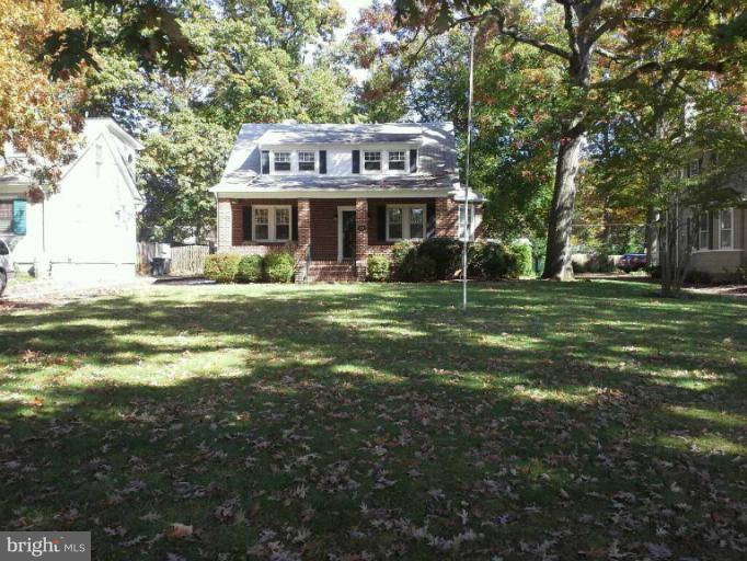 421 Rolling Rd. Catonsville, MD 21228 - Photo 19 of 26 a front view of a house with a garden