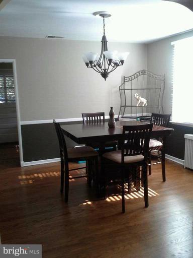 421 Rolling Rd. Catonsville, MD 21228 - Photo 5 of 26 a view of a dining room with furniture and wooden floor