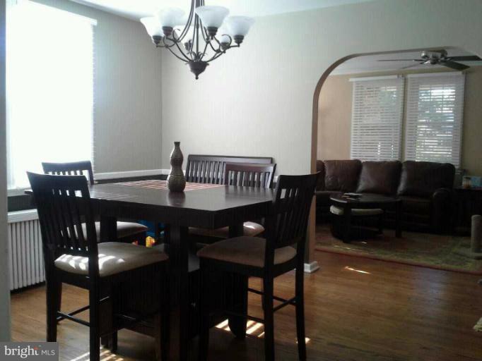 421 Rolling Rd. Catonsville, MD 21228 - Photo 6 of 26 a view of a dining room with furniture and wooden floor