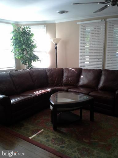 421 Rolling Rd. Catonsville, MD 21228 - Photo 9 of 26 a living room with furniture and a window