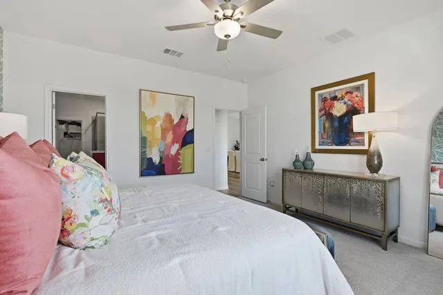 a bedroom with a bed and window