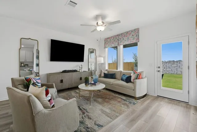 a en suite bathroom with a granite countertop sink mirror and shower