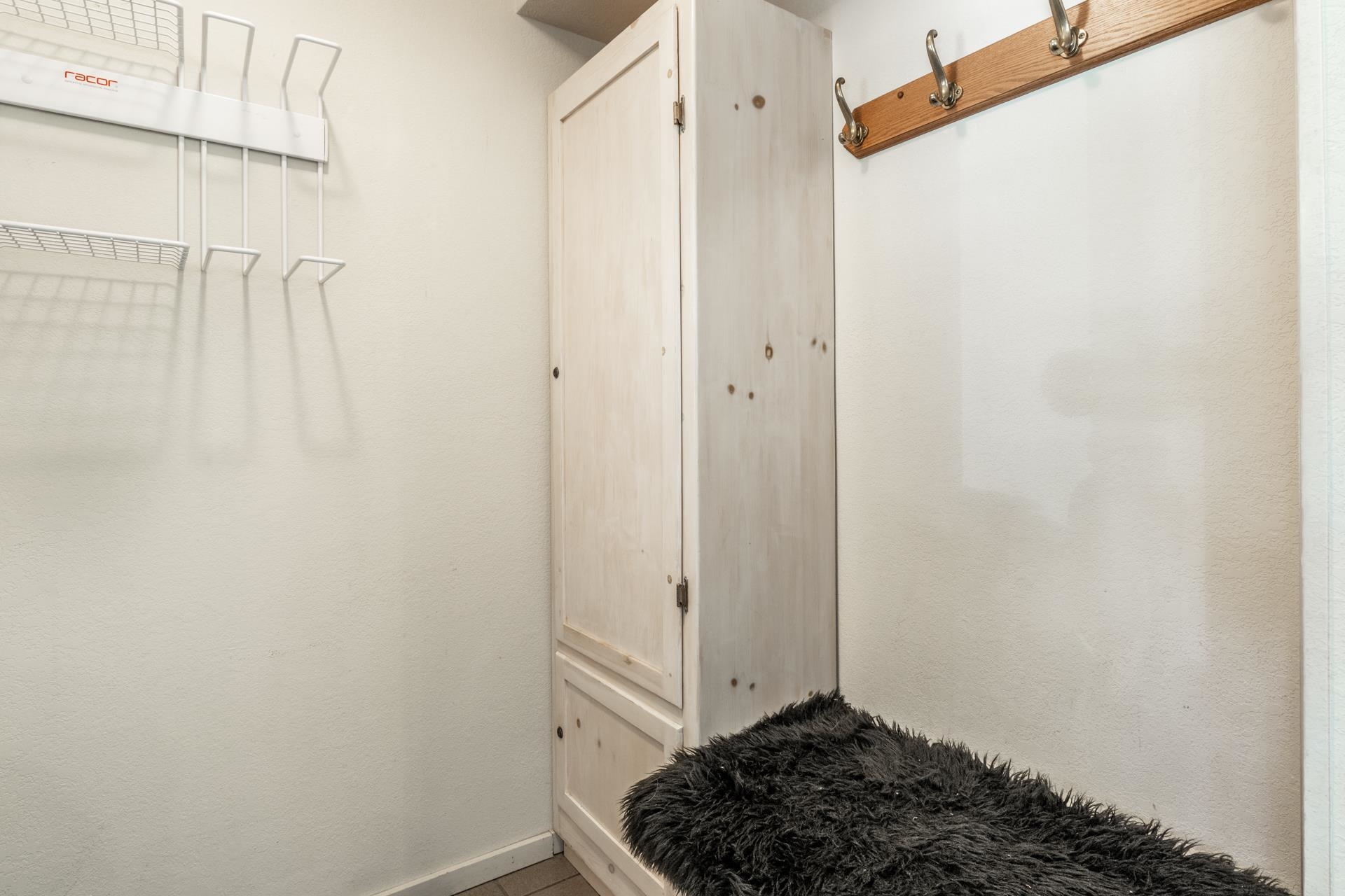609 Golden Creek Road, Unit 609 Mammoth Lakes, CA 93546 - Photo 31 of 42 Built-in wooden cabinetry providing vertical storage