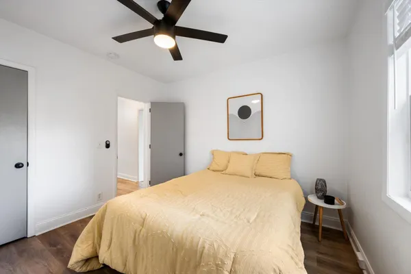 a bedroom with a bed and a window