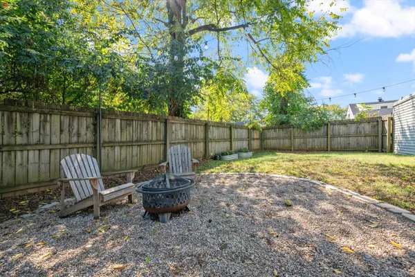 a view of a backyard with a swing