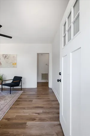 a view of a livingroom with furniture and wooden floor