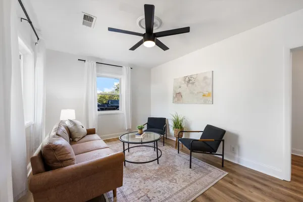 a living room with furniture and a window