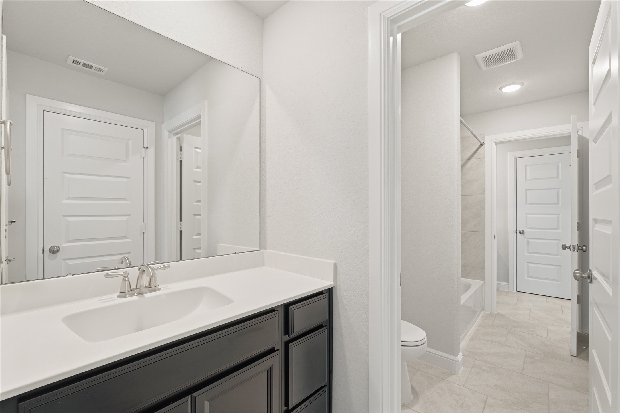 15846 Weston Ridge Drive Humble, TX 77346 - Photo 15 of 22 a bathroom with a sink and a mirror