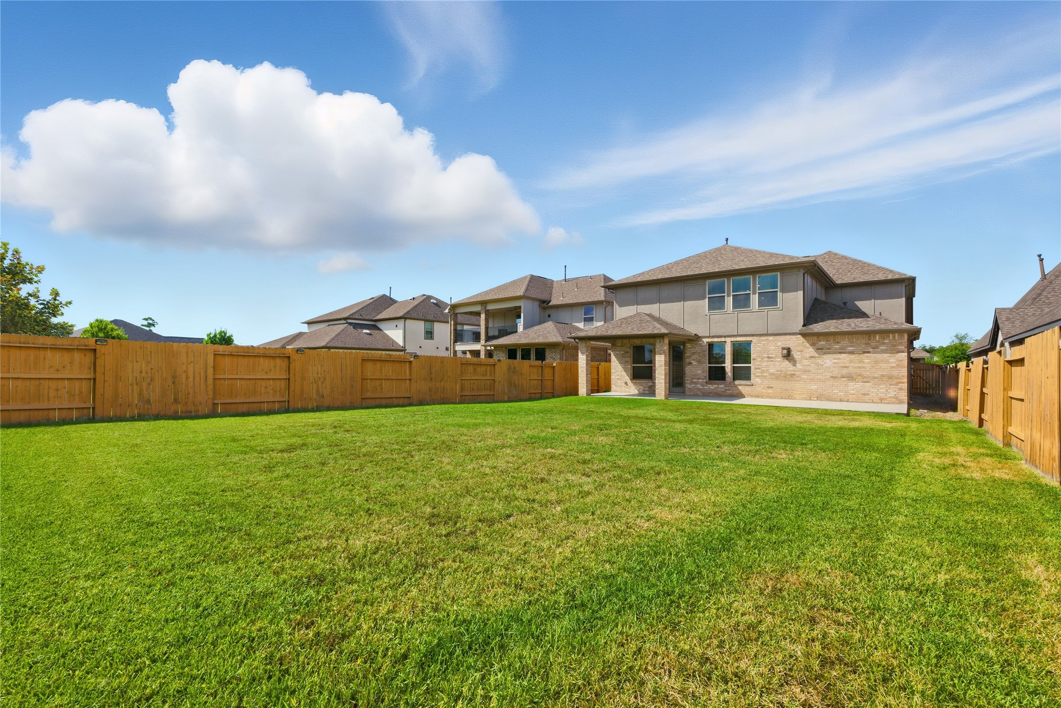 15846 Weston Ridge Drive Humble, TX 77346 - Photo 18 of 22 a view of a house with a big yard and large trees