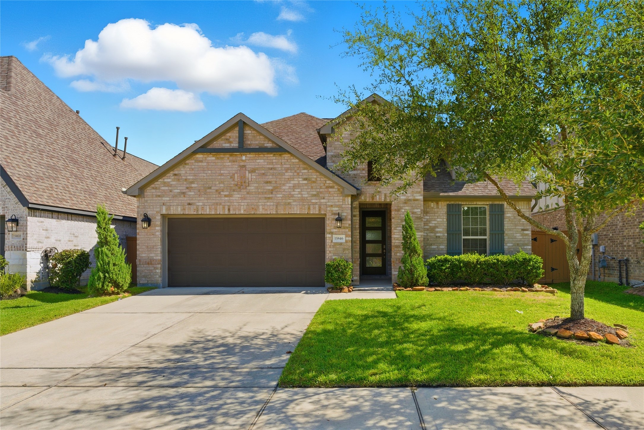 15846 Weston Ridge Drive Humble, TX 77346 - Photo 5 of 22 a front view of a house with a yard and garage