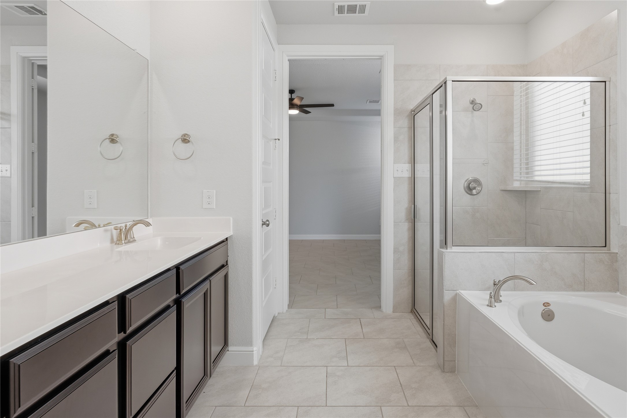 15846 Weston Ridge Drive Humble, TX 77346 - Photo 9 of 22 a bathroom with a tub sink shower and mirror