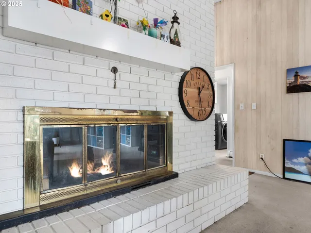 a fireplace with a stove and a table