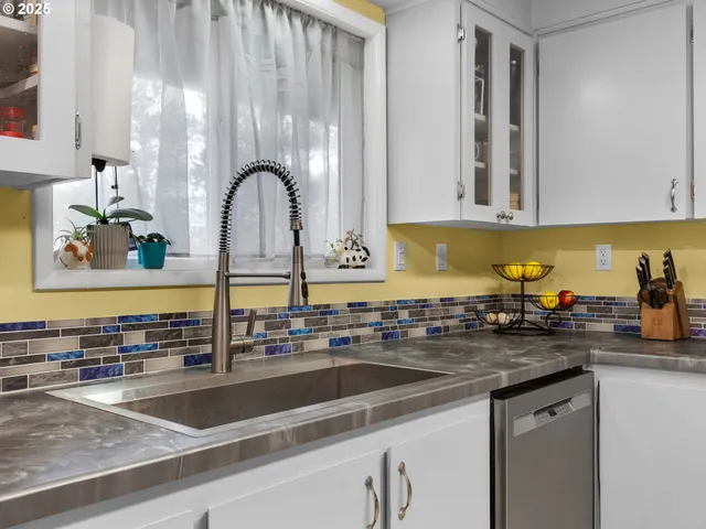 a kitchen with a sink and a cabinets