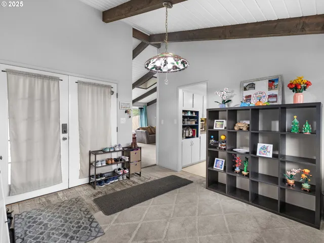 a living room with lots of furniture and a chandelier