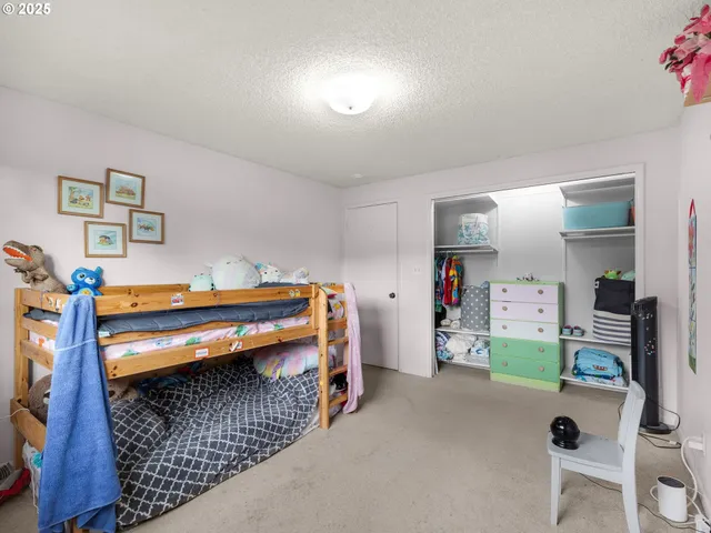 a bedroom with bed and a window