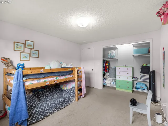 a bedroom with bed and a window