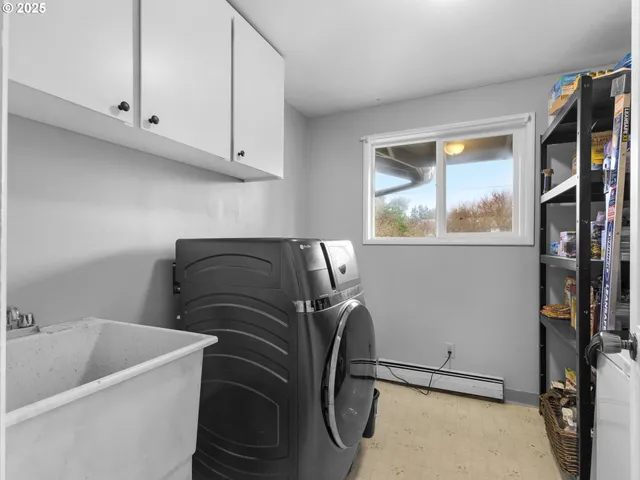 a bathroom with a bathtub and a window