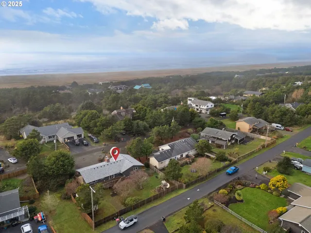 an aerial view of multiple houses with yard