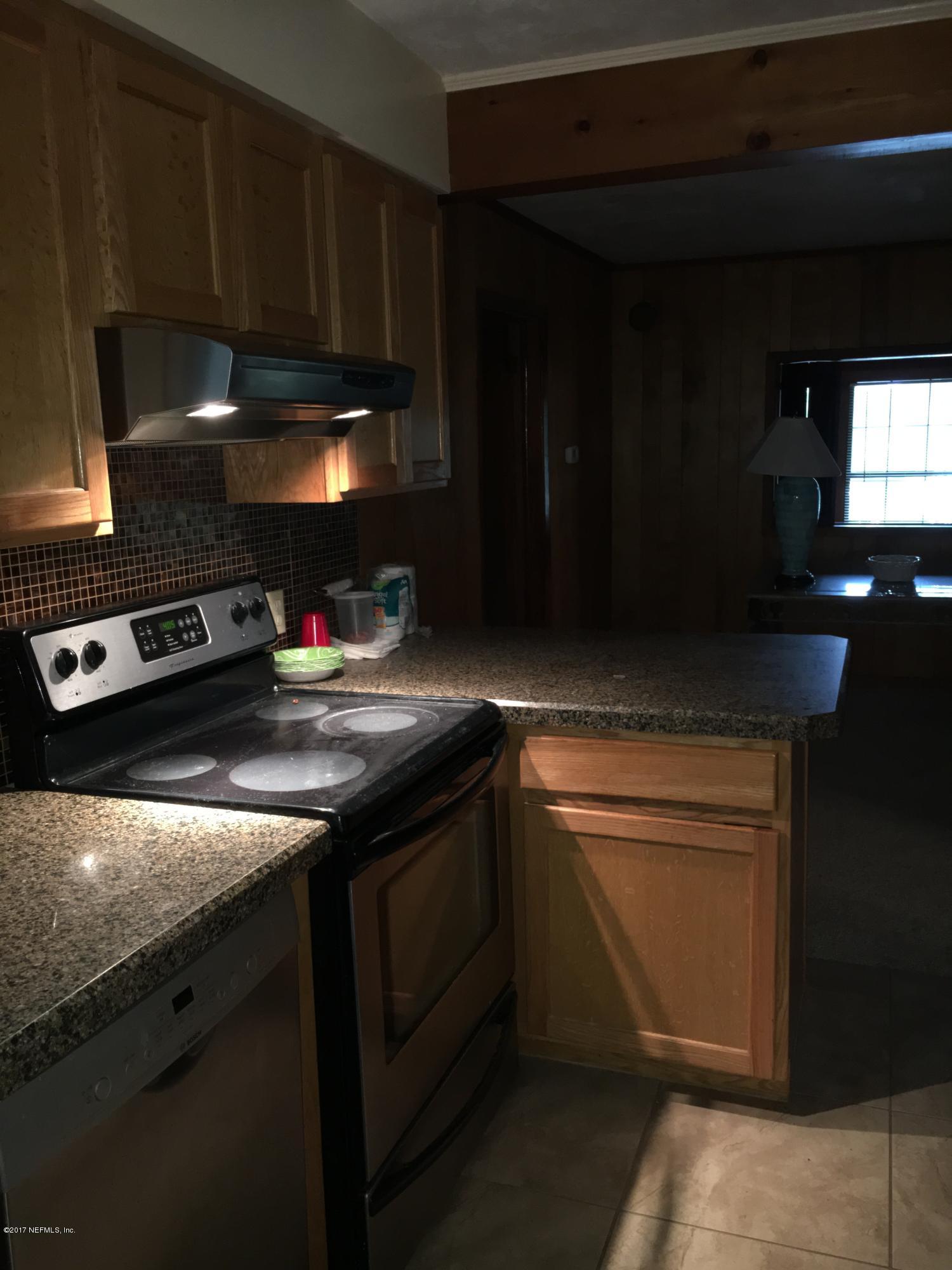 8130 Alderman Road Melrose, FL 32666 - Photo 12 of 36 Kitchen Towards Dining Room