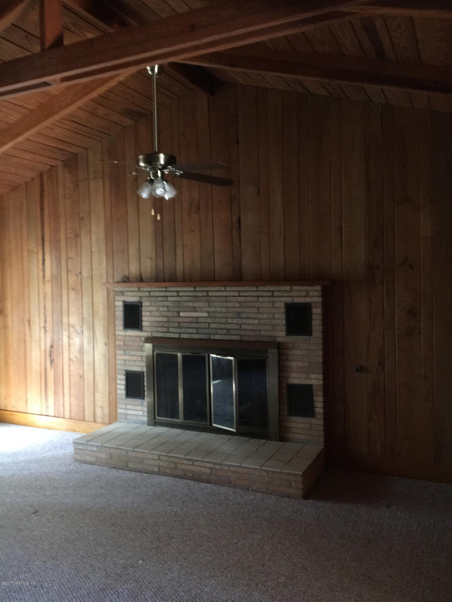 8130 Alderman Road Melrose, FL 32666 - Photo 13 of 36 Spacious Living Room - Fireplace
