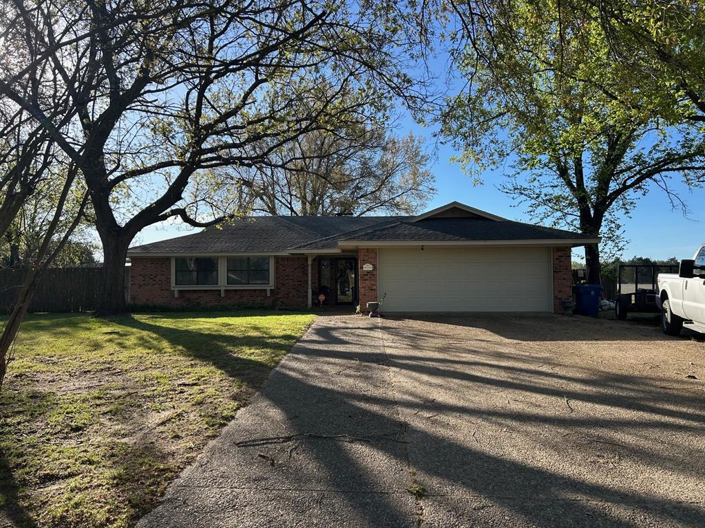 1000 Clark Street Mexia, TX 76667 - Photo 1 of 14 a front view of a house with a yard