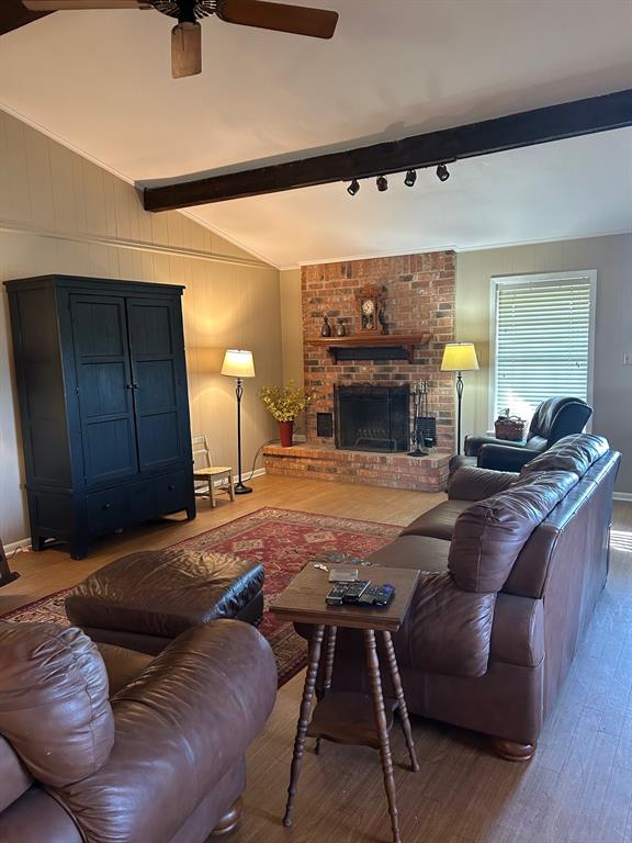 1000 Clark Street Mexia, TX 76667 - Photo 2 of 14 a living room with furniture and a fireplace