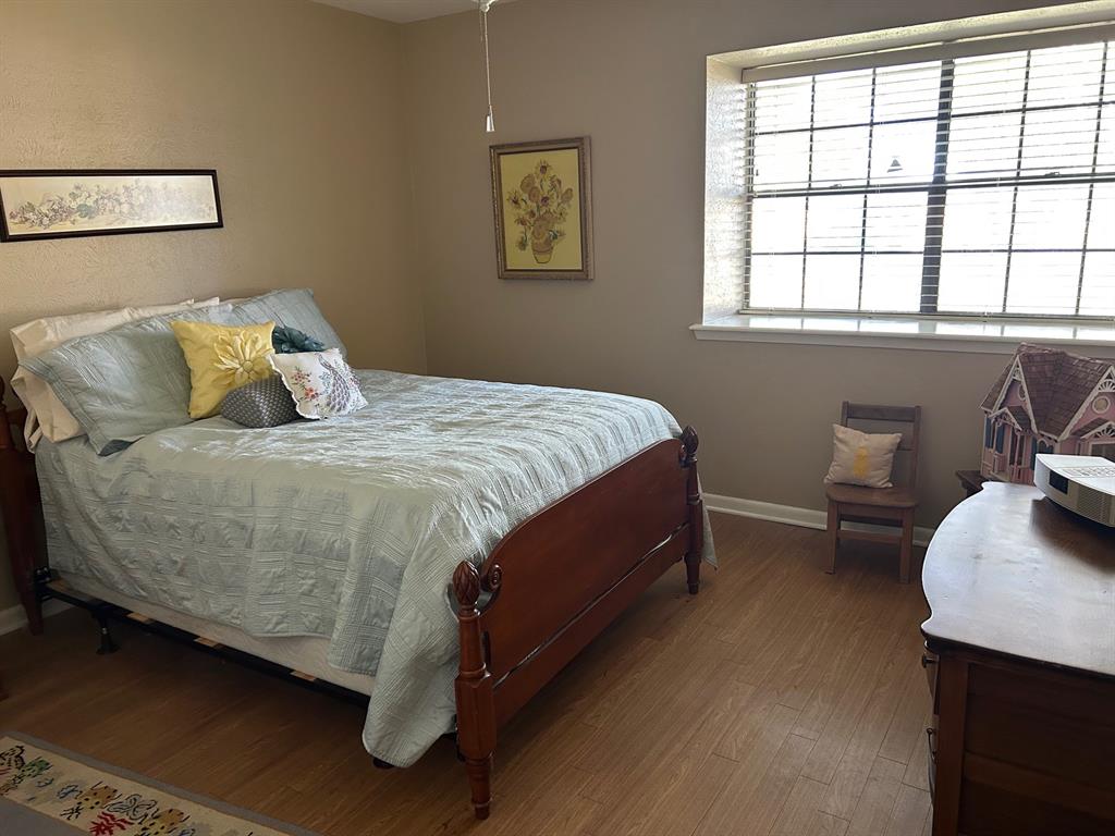 1000 Clark Street Mexia, TX 76667 - Photo 3 of 14 a bed sitting in a bedroom next to a window