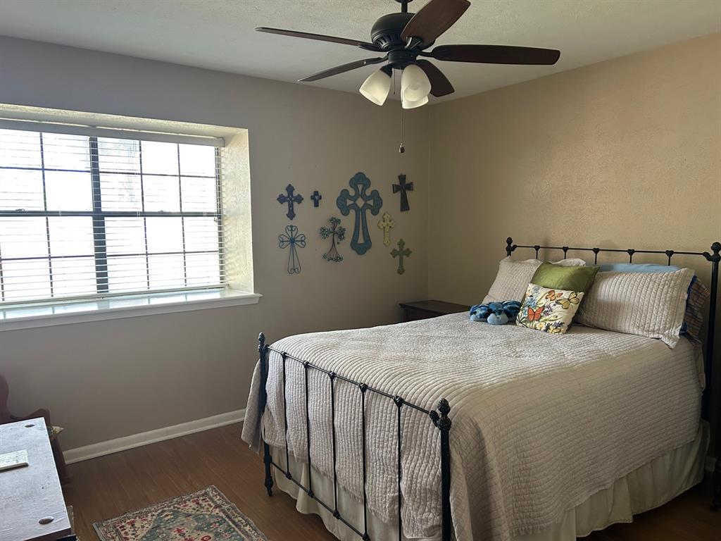 1000 Clark Street Mexia, TX 76667 - Photo 4 of 14 a bedroom with a bed and a window