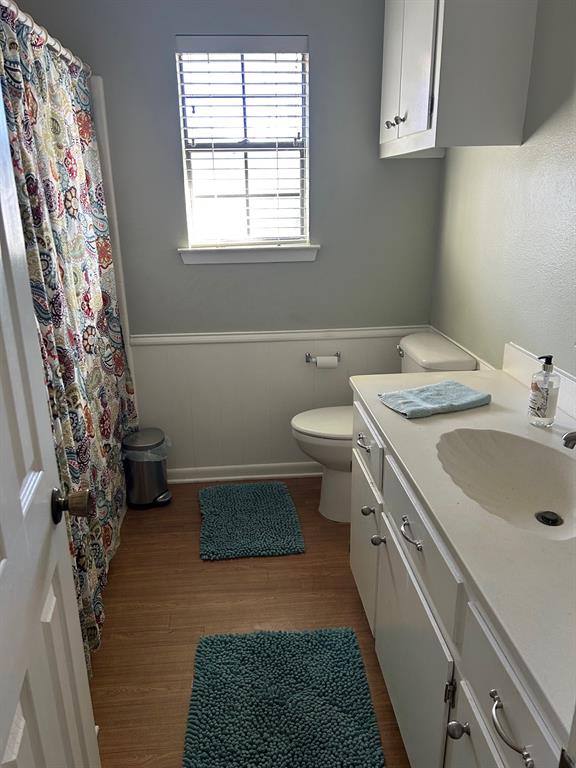 1000 Clark Street Mexia, TX 76667 - Photo 5 of 14 a bathroom with a sink toilet and window