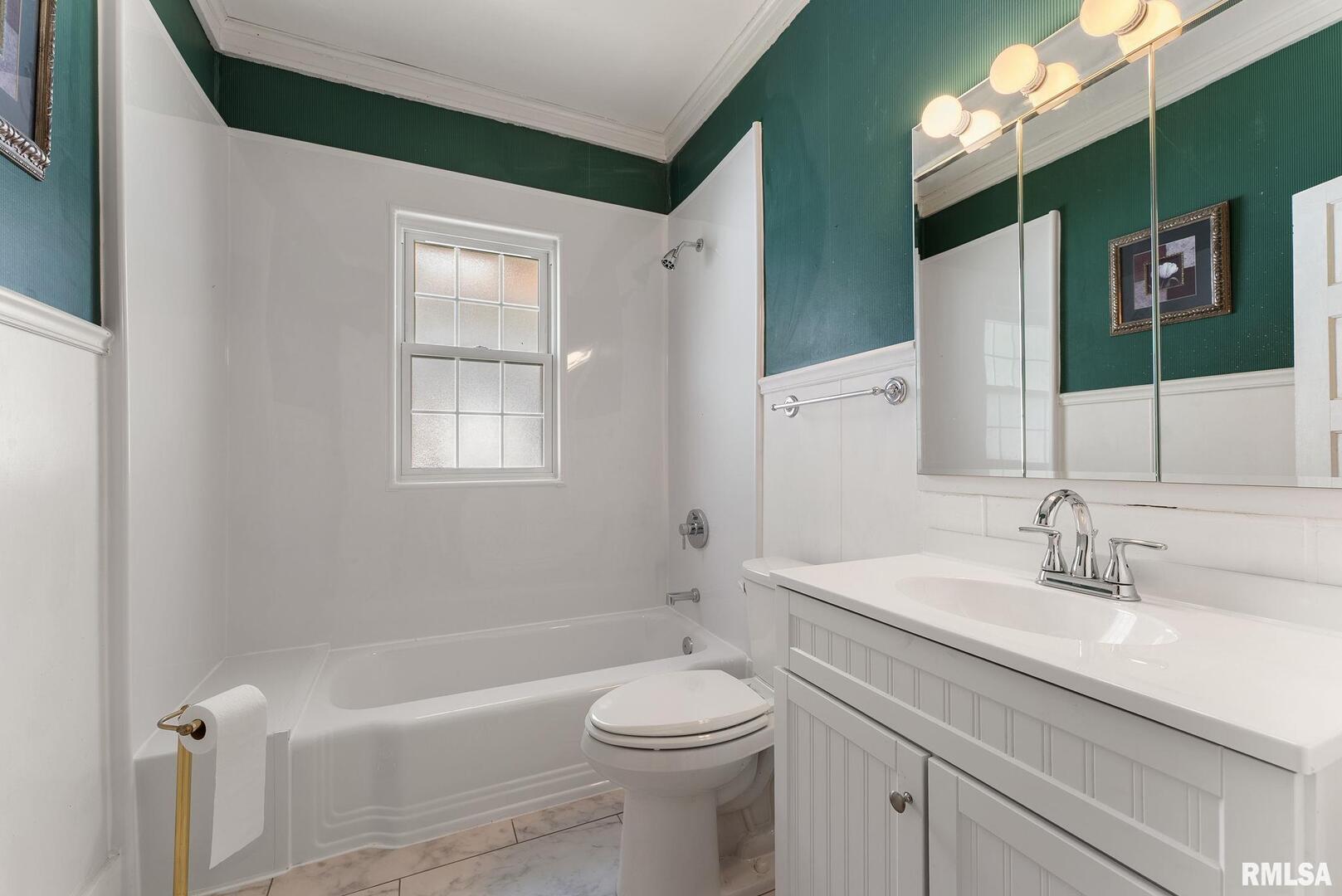 1904 30th Street Moline, IL 61265 - Photo 10 of 13 a bathroom with a sink a toilet and shower