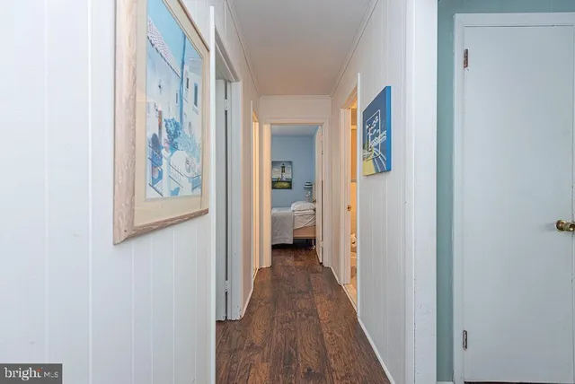 a bedroom with a bed and a lamp on table