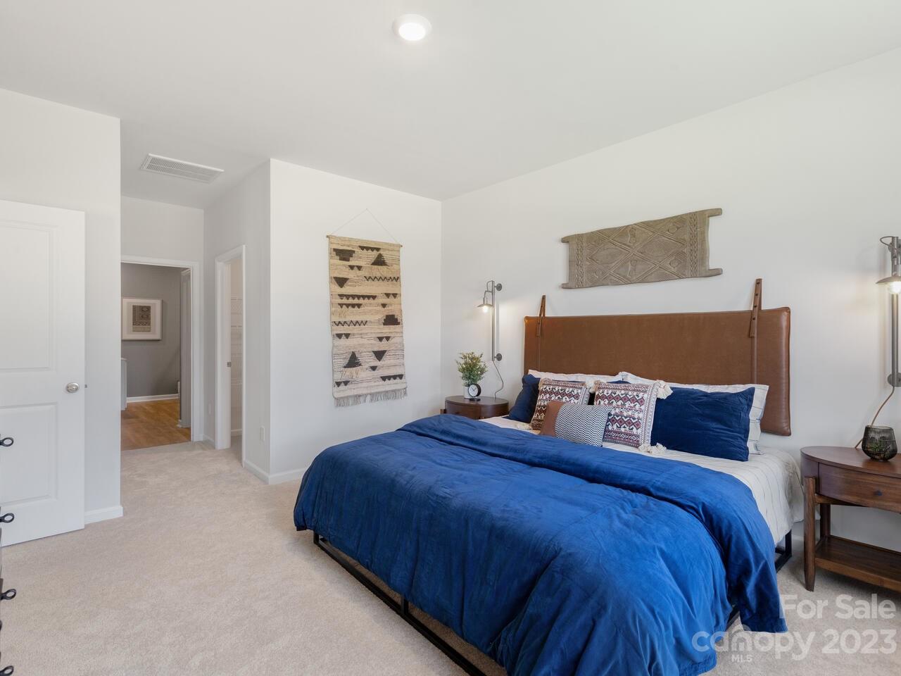 2047 Vanderlyn Street Monroe, NC 28112 - Photo 14 of 16 a bedroom with a bed and a couch