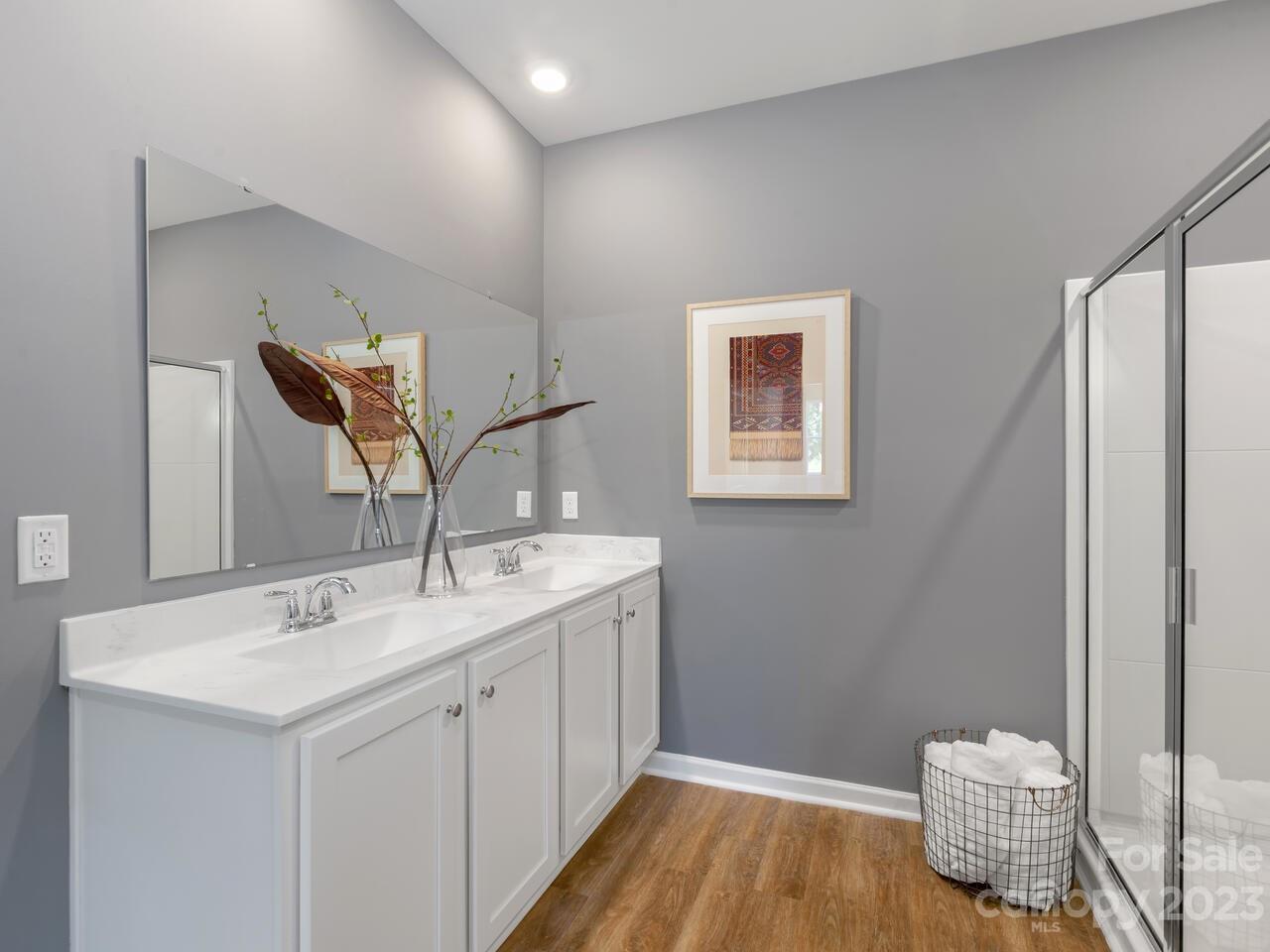 2047 Vanderlyn Street Monroe, NC 28112 - Photo 16 of 16 a bathroom with a sink and a mirror