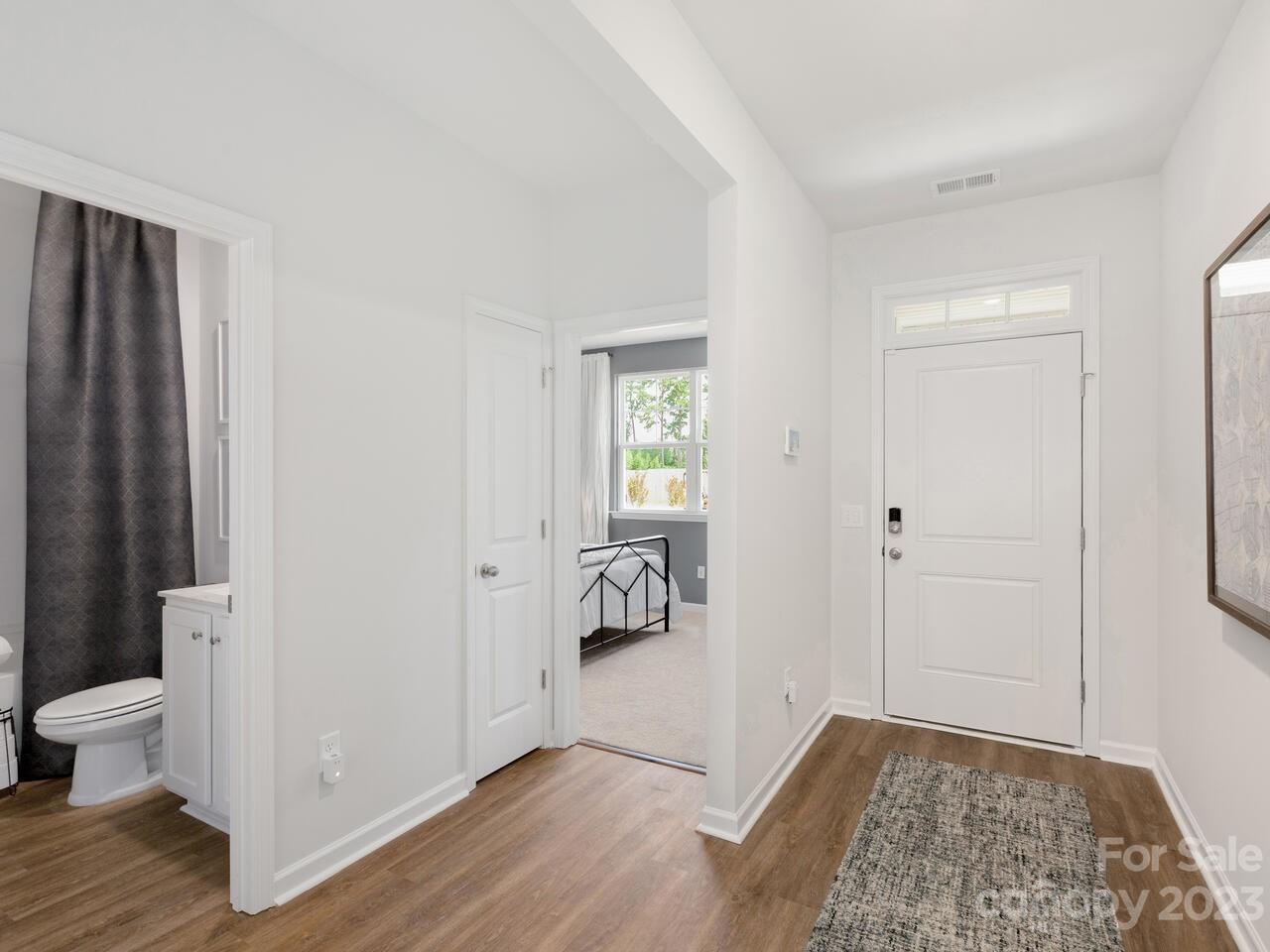 2047 Vanderlyn Street Monroe, NC 28112 - Photo 3 of 16 a view of an empty room and wooden floor