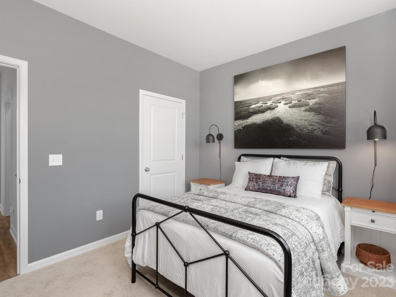 2047 Vanderlyn Street Monroe, NC 28112 - Photo 5 of 16 a bedroom with a bed and a flat screen tv