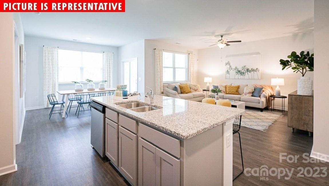 2047 Vanderlyn Street Monroe, NC 28112 - Photo 9 of 16 a large living room with a large window