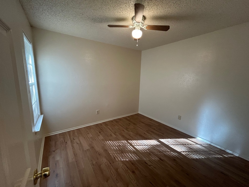 4600 Brown Bark Place, Unit A Austin, TX 78727 - Photo 12 of 18 wooden floor in an empty room