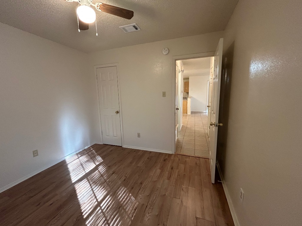 4600 Brown Bark Place, Unit A Austin, TX 78727 - Photo 13 of 18 wooden floor in an empty room
