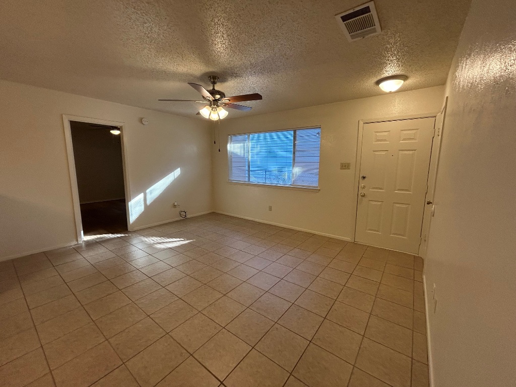 4600 Brown Bark Place, Unit A Austin, TX 78727 - Photo 16 of 18 a view of an empty room with a window