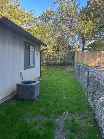 a backyard of a house with lots of green space