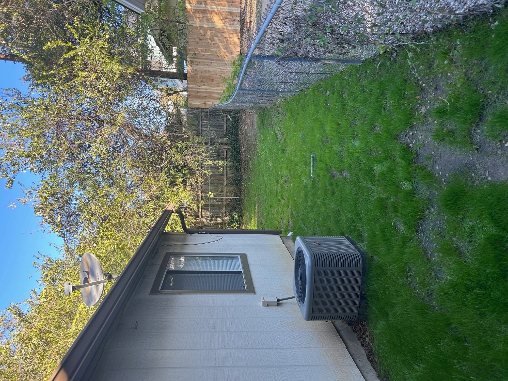 4600 Brown Bark Place, Unit A Austin, TX 78727 - Photo 17 of 18 a backyard of a house with lots of green space
