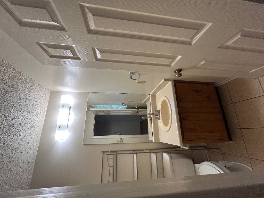 4600 Brown Bark Place, Unit A Austin, TX 78727 - Photo 9 of 18 a bathroom with a sink and a mirror