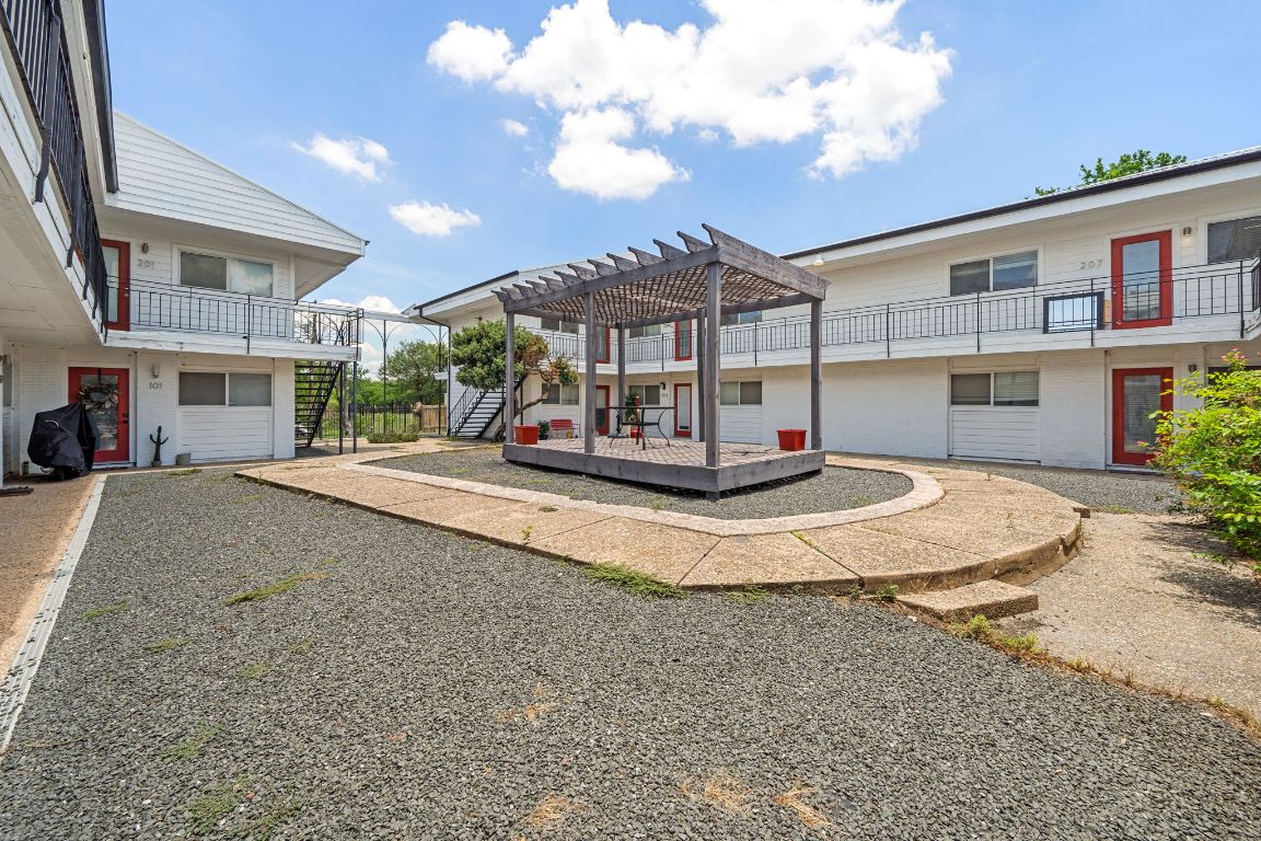 1313 East 52nd Street, Unit 205 Austin, TX 78723 - Photo 15 of 16 a sign board with buildings and yard in front of it