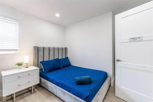 a view of house with backyard and outdoor seating